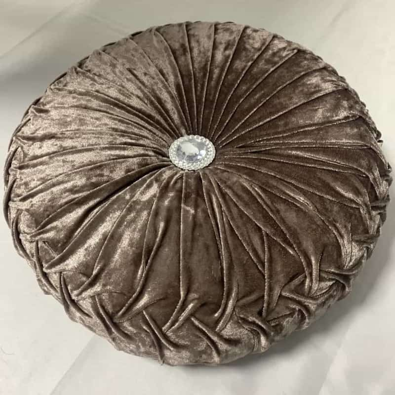 Coussin design rond bronze avec diamant au centre