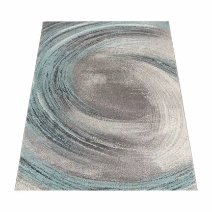 Tapis Design Vertigo Turquoise sur fond blanc
