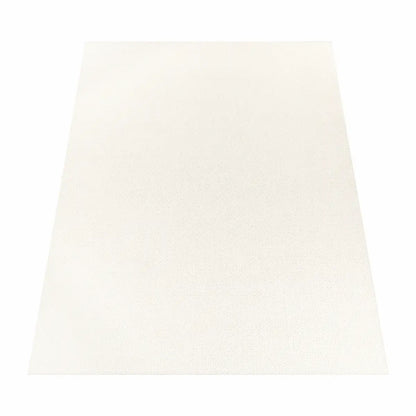 Tapis Uni Borea Cream sur fond blanc