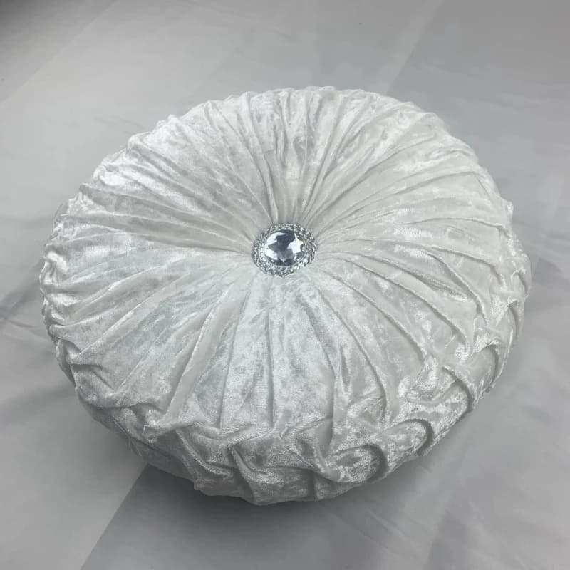 Coussin design rond blanc avec diamant au centre